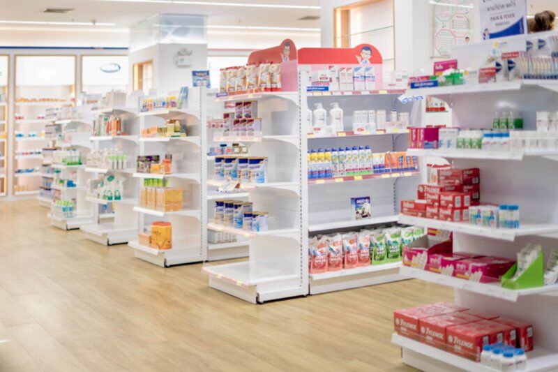 over the counter drugs on shelves in pharmacy